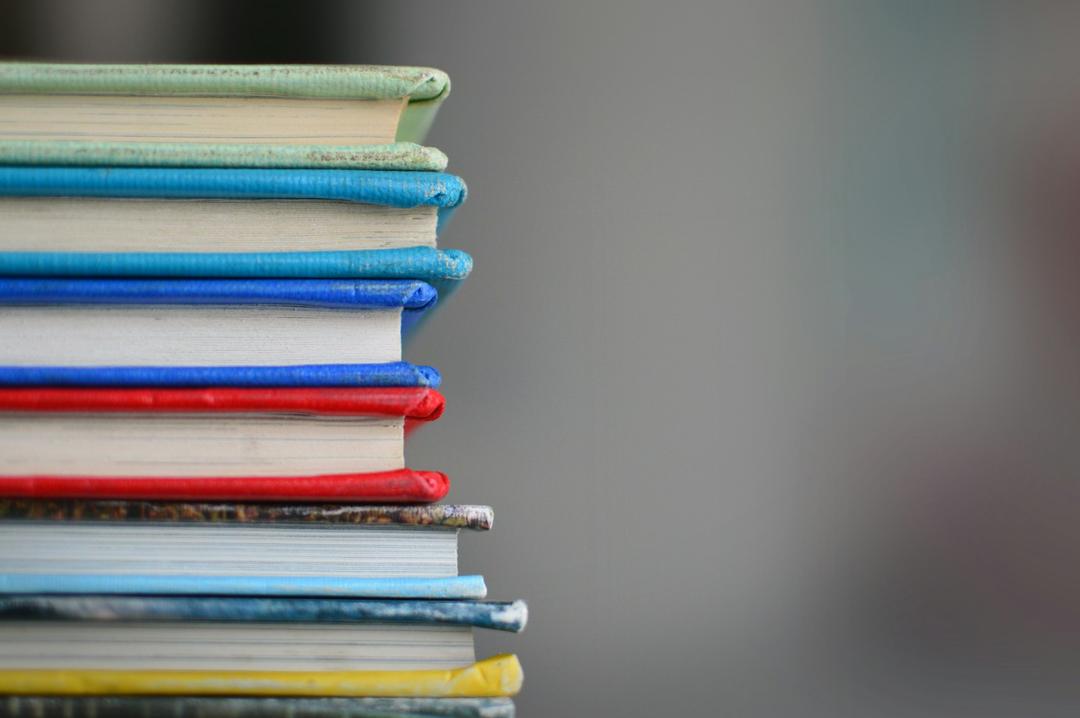 Various books stacked up on each other